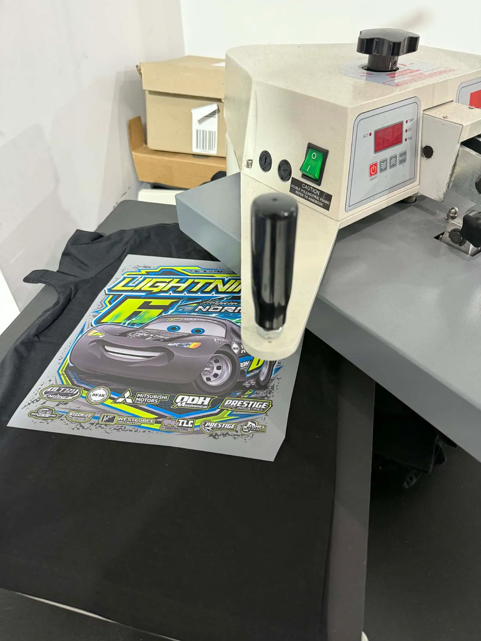 Image: A vibrant, full-colour design being printed onto a t-shirt using DTF technology.